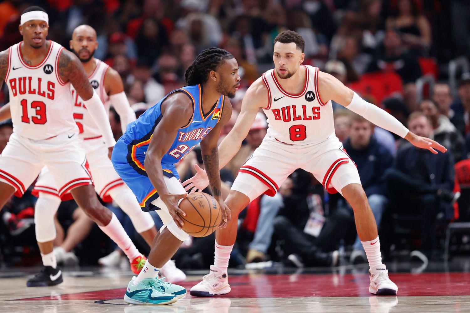 Oct 25, 2023; Chicago, Illinois, USA; Chicago Bulls guard Zach LaVine (8) defends against Oklahoma City Thunder guard Cason Wallace (22) during the first half of a basketball game at United Center. Mandatory Credit: Kamil Krzaczynski-USA TODAY Sports