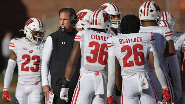 Oct 21, 2023; Champaign, Illinois, USA; Wisconsin Badgers head coach Luke Fickell with his players during the first half against the Illinois Fighting Illini at Memorial Stadium. Mandatory Credit: Ron Johnson-USA TODAY Sports