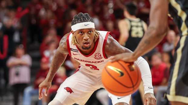 Razorbacks guard El Ellis defending against Purdue on Saturday