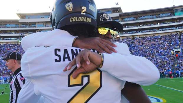 Deion Sanders hugging Shedeur Sanders at Rose Bowl on Oct. 28