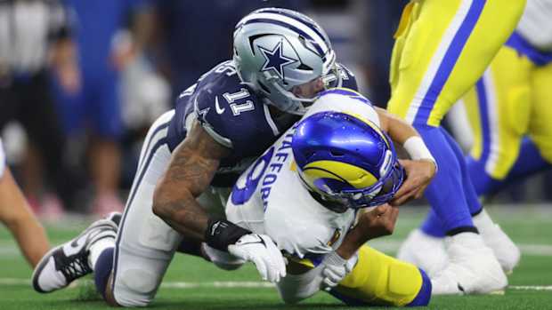 Matthew Stafford is sacked by the Cowboys.