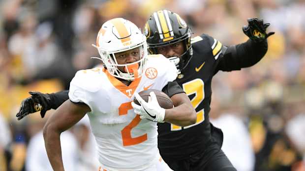 Tennessee running back Jabari Small (2) runs the ball while defended by Missouri defensive back Shawn Robinson (12) during an NCAA football game between Tennessee and Missouri on Faurot Field at Memorial Stadium in Columbia, Mo., on Saturday, Oct. 2 , 2021.