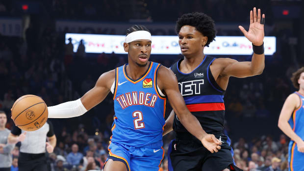 Oct 30, 2023; Oklahoma City, Oklahoma, USA; Oklahoma City Thunder guard Shai Gilgeous-Alexander (2) drives around Detroit Pistons guard Killian Hayes (7) during the first quarter at Paycom Center.