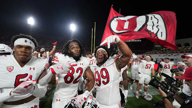Oct 21, 2023; Los Angeles, California, USA; Utah Utes receiver Landen King (82) and defensive tackle Tevita Fotu (99) celebrate after the game against the Southern California Trojans at United Airlines Field at Los Angeles Memorial Coliseum.
