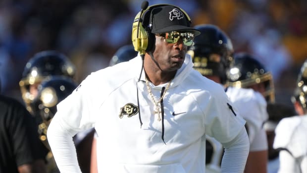 Colorado Buffaloes head coach Deion Sanders walks the sidelines as his team takes on the ASU Sun Devils at Mountain America Stadium