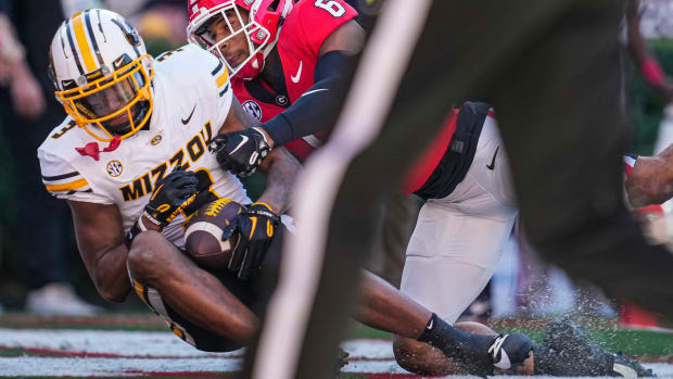 Missouri Tigers wide receiver Luther Burden III (3) catches a touchdown pass behind Georgia Bulldogs defensive back Daylen Everette (6) during the first half at Sanford Stadium.