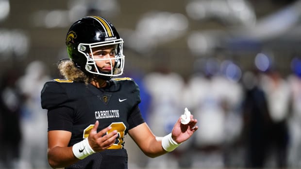 Oct 20, 2023; Carrollton, GA, USA; Carrollton Trojans quarterback Julian Lewis (10) reacts to a play against the Westlake Lions during the first half at Grisham Stadium. The 15-year-old Carrollton High student has already committed to playing for the University of Southern California Trojans and has been considered one of the top high school quarterback prospects. Mandatory Credit: John David Mercer-USA TODAY Sports