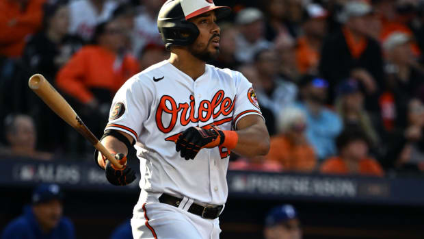 Oct 7, 2023; Baltimore, Maryland, USA; Baltimore Orioles designated hitter Anthony Santander (25) hits a home run against the Texas Rangers during the sixth inning in game one of the ALDS for the 2023 MLB playoffs at Oriole Park at Camden Yards. Mandatory Credit: Tommy Gilligan-USA TODAY Sports