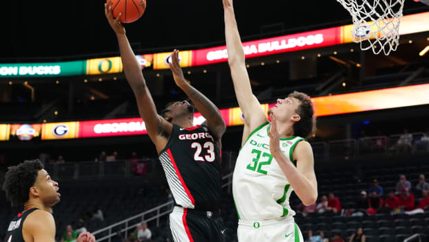 Nov 6, 2023; Las Vegas, Nevada, USA; Georgia Bulldogs forward Jalen DeLoach (23) shoots against Oregon Ducks center Nate Bittle (32) during the second half at T-Mobile Arena. Mandatory Credit: Stephen R. Sylvanie-USA TODAY Sports  