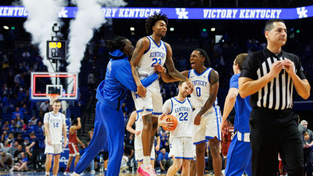 Nov 6, 2023; Lexington, Kentucky, USA; Kentucky Wildcats forward Aaron Bradshaw (left), guard Jordan Burks (23) and guard Rob Dillingham (0) celebrate after the game against the New Mexico State Aggies at Rupp Arena at Central Bank Center. Mandatory Credit: Jordan Prather-USA TODAY Sports
