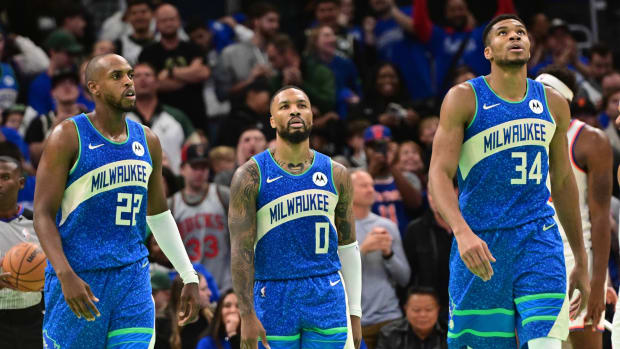 Milwaukee Bucks center Khris Middleton (22), guard Damian Lillard (0) and forward Giannis Antetokounmpo (34) 