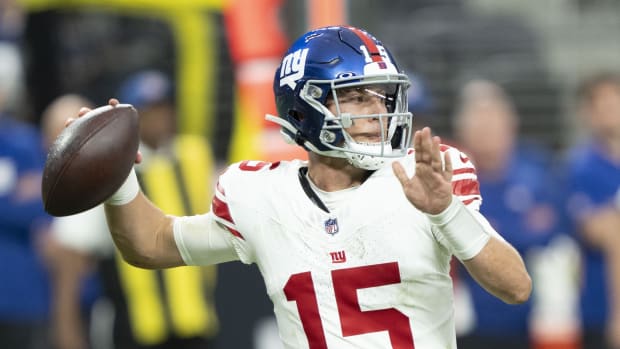 November 5, 2023; Paradise, Nevada, USA; New York Giants quarterback Tommy DeVito (15) passes the football against the Las Vegas Raiders during the second quarter at Allegiant Stadium.