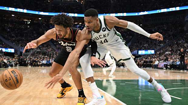 Detroit Pistons guard Cade Cunningham (2) and Milwaukee Bucks forward Giannis Antetokounmpo (34)
