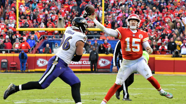 Dec 9, 2018; Kansas City, MO, USA; Kansas City Chiefs quarterback Patrick Mahomes (15) throws a pass as Baltimore Ravens defensive end Brent Urban (96) defends during the second half at Arrowhead Stadium. Mandatory Credit: Denny Medley-USA TODAY Sports  