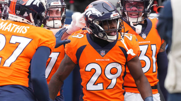 Denver Broncos cornerback Ja'Quan McMillian (29) celebrates his interception in the second quarter against the Kansas City Chiefs at Empower Field at Mile High.