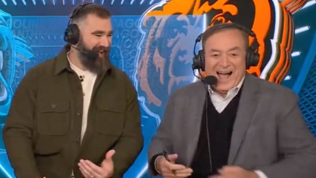Al Michaels and Jason Kelce talk in the booth.