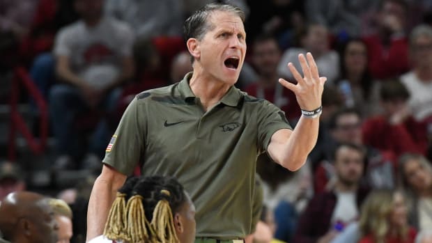 Razorbacks coach Eric Musselman disputing a call by an official against Gardner-Webb