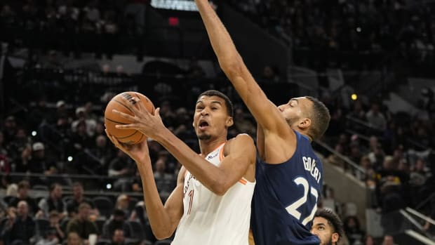 Nov 10, 2023; San Antonio, Texas, USA; San Antonio Spurs forward Victor Wembanyama (1) drives to the basket against Minnesota Timberwolves center Rudy Gobert (27) during the first half at Frost Bank Center.