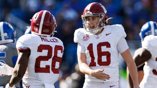 Alabama Crimson Tide place kicker Will Reichard (16) celebrates with Alabama Crimson Tide running back Jam Miller (26) during the first quarter against the Kentucky Wildcats at Kroger Field.