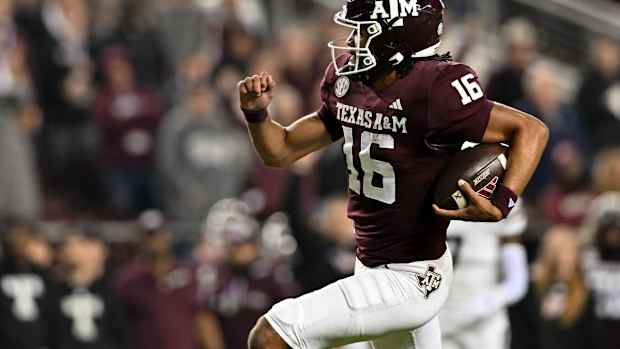 Nov 11, 2023; College Station, Texas, USA; Texas A&M Aggies quarterback Jaylen Henderson (16) runs the ball into the end zone for a touchdown during the first quarter against the Mississippi State Bulldogs at Kyle Field.