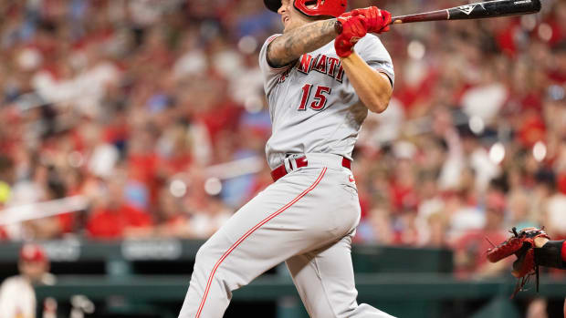 Sep 30, 2023; St. Louis, Missouri, USA; Cincinnati Reds third baseman Nick Senzel (15) hits a homerun in the fifth inning against the St. Louis Cardinals at Busch Stadium. Mandatory Credit: Zach Dalin-USA TODAY Sports  