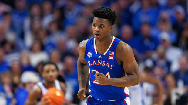 Jan 28, 2023; Lexington, Kentucky, USA; Kansas Jayhawks forward K.J. Adams Jr. (24) runs down the court during the second half against the Kentucky Wildcats at Rupp Arena at Central Bank Center. Mandatory Credit: Jordan Prather-USA TODAY Sports  