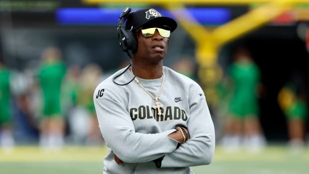 Colorado Buffaloes head coach Deion Sanders watches the reply board during the first half against the Oregon Ducks at Autzen Stadium