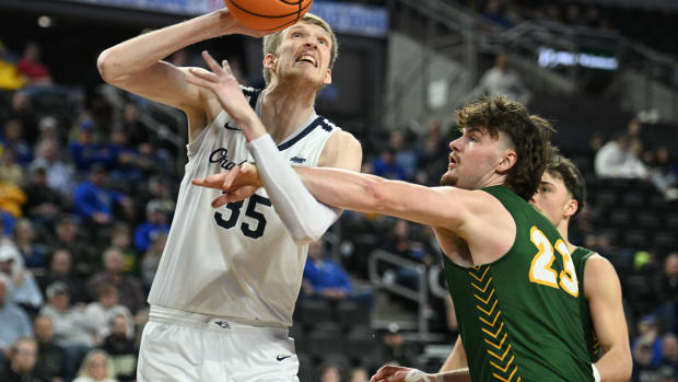 North Dakota State Bison forward Andrew Morgan (23) fouls Oral Roberts Golden Eagles forward Connor Vanover (35) in the second half at Denny Sanford Premier Center in the 2023 Summit Conference Tournament Championship.