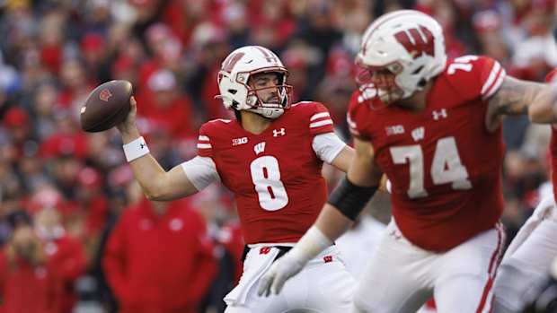 Nov 11, 2023; Madison, Wisconsin, USA; Wisconsin Badgers quarterback Tanner Mordecai (8) throws a pass during the second quarter against the Northwestern Wildcats at Camp Randall Stadium. Mandatory Credit: Jeff Hanisch-USA TODAY Sports