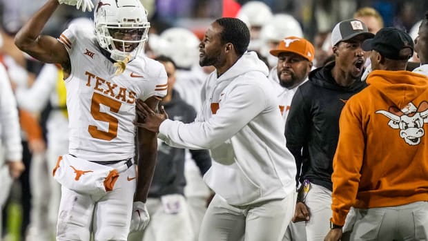 Texas Longhorns wide receiver Adonai Mitchell (5) celebrates a first down catch against TCU Horned Frogs late in the fourth quarter to keep theclock running in an NCAA college football game, Saturday, November. 11, 2023, at Amon G. Carter Stadium in Fort Worth, Texas. Texas Longhons won 29-26.  