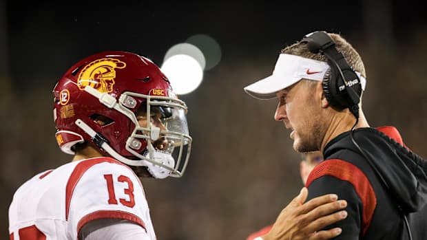 USC Trojans quarterback Caleb Williams (13) talks with USC Trojans head coach Lincoln Riley during the first half of the game against No. 6 Oregon Ducks on Saturday, Nov. 11, 2023, at Autzen Stadium in Eugene, Ore.  