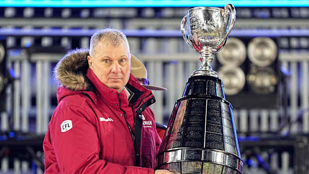 Dec 12, 2021; Hamilton, Ontario, CAN; Canadian Football League commissioner Randy Ambrosie goes to present the Grey Cup to the Winnipeg Blue Bombers after a win over the Hamilton Tiger-Cats in the 108th Grey Cup football game at Tim Hortons Field. Mandatory Credit: John E. Sokolowski-USA TODAY Sports