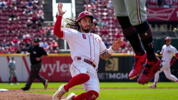 Cincinnati Reds second baseman Jonathan India (6) slides into third after Spencer Steer flies out in the third inning of the MLB Interleague game between the Cincinnati Reds and the Minnesota Twins at Great American Ball Park in downtown Cincinnati on Wednesday, Sept. 20, 2023.  