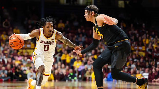 Minnesota Golden Gophers guard Elijah Hawkins (0) drives while Missouri Tigers forward Noah Carter (35) defends during the first half at Williams Arena.