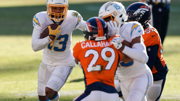 Nov 1, 2020; Denver, Colorado, USA; Los Angeles Chargers wide receiver Keenan Allen (13) runs the ball against Denver Broncos linebacker Malik Reed (59) as wide receiver Jalen Guyton (15) defends against cornerback Bryce Callahan (29) in the first quarter at Empower Field at Mile High. Mandatory Credit: Isaiah J. Downing-USA TODAY Sports  