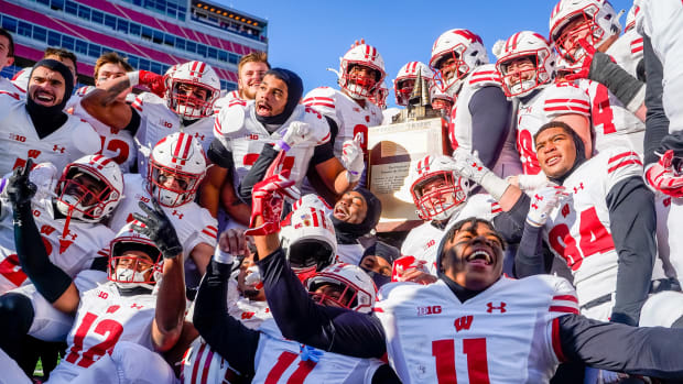 Nov 19, 2022; Lincoln, Nebraska, USA; The Wisconsin Badgers hoist the Freedom Trophy after defeating the Nebraska Cornhuskers 15-14 at Memorial Stadium. Mandatory Credit: Dylan Widger-USA TODAY Sports
