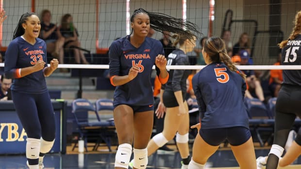 Veresia Yon reacts after recording a kill during the Virginia volleyball match against Wofford at Memorial Gymnasium.
