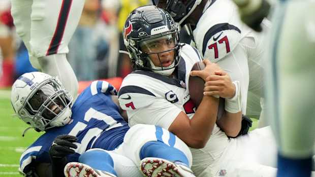 Indianapolis Colts defensive end Kwity Paye (51) smiles after bringing down Houston Texans quarterback C.J. Stroud (7) on Sunday, Sept. 17, 2023, during a game against the Houston Texans at NRG Stadium in Houston