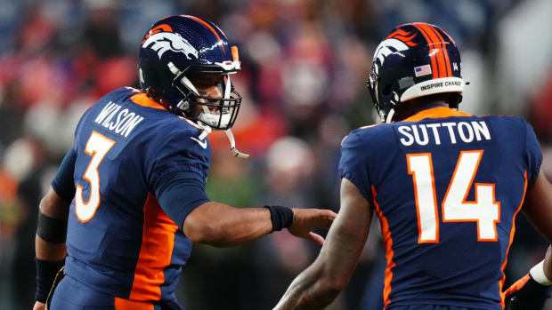 Denver Broncos quarterback Russell Wilson (3) and wide receiver Courtland Sutton (14) before the game at Empower Field at Mile High.