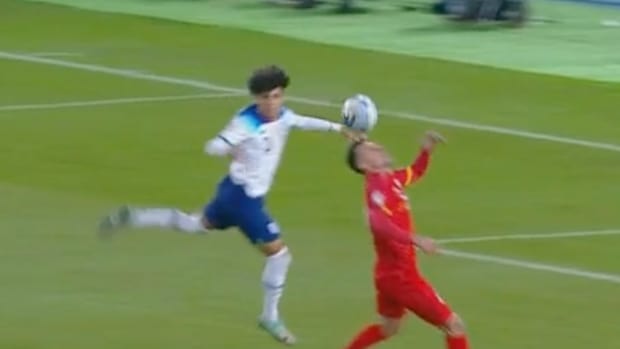 Rico Lewis (left) pictured moments after he apparently fouled Bojan Miovski during England's Euro 2024 qualifiers against North Macedonia in November 2023