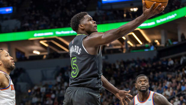 Nov 20, 2023; Minneapolis, Minnesota, USA; Minnesota Timberwolves guard Anthony Edwards (5) shoots against the New York Knicks in the second half at Target Center.
