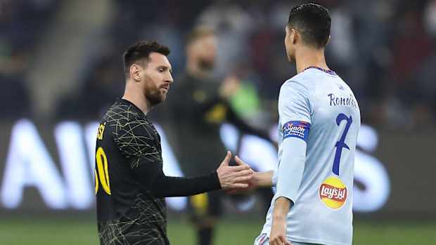 Lionel Messi greeting Cristiano Ronaldo