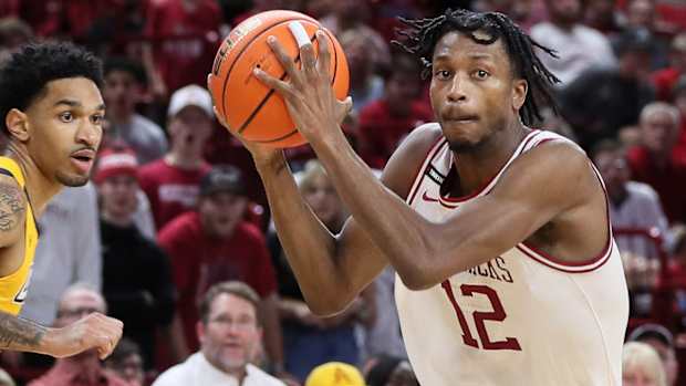 Razorbacks Tramon Mark drives against UNC-Greensboro last Friday night