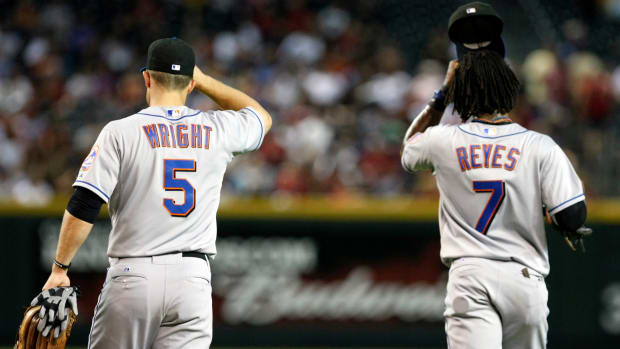 July 20, 2010; Phoenix, AZ, USA; New York Mets third baseman David Wright (5) and shortstop Jose Reyes (7) during the game against the Arizona Diamondbacks at Chase Field. Mandatory Credit: Rick Scuteri-USA TODAY Sports