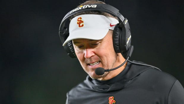 Oct 14, 2023; South Bend, Indiana, USA; USC Trojans head coach Lincoln Riley talks on his headset in the third quarter against the Notre Dame Fighting Irish at Notre Dame Stadium. Mandatory Credit: Matt Cashore-USA TODAY Sports  