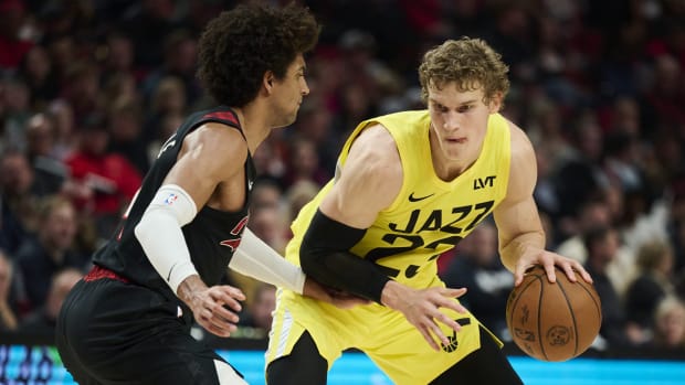 Utah Jazz forward Lauri Markkanen (23) dribbles the ball during the first half against Portland Trail Blazers guard Matisse Thybulle (4) at Moda Center.