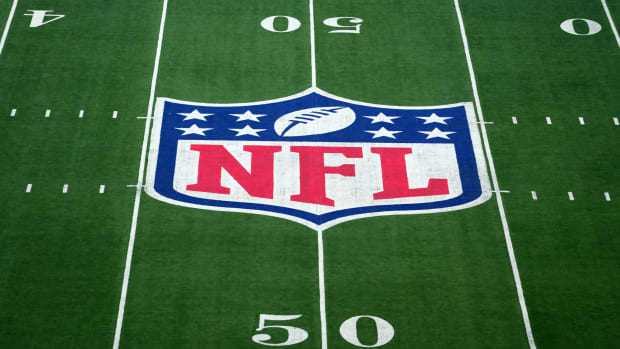 The NFL logo painted on the field before a game.