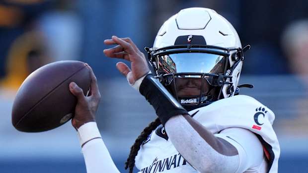 Cincinnati Bearcats quarterback Emory Jones (5) throws in the second quarter during an NCAA college football game between the Cincinnati Bearcats and the West Virginia Mountaineers, Saturday, Nov. 18, 2023, at Milan Puskar Stadium in Morgantown, W. Va.