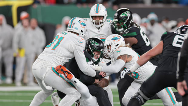 Jets' QB Tim Boyle is sacked by the Dolphins