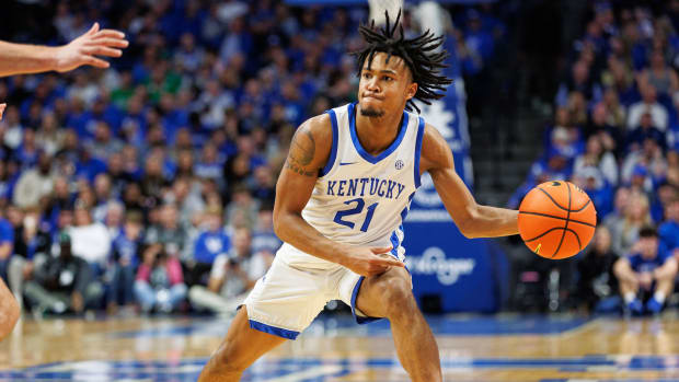 Nov 24, 2023; Lexington, Kentucky, USA; Kentucky Wildcats guard D.J. Wagner (21) passes the ball during the second half against the Marshall Thundering Herd at Rupp Arena at Central Bank Center. Mandatory Credit: Jordan Prather-USA TODAY Sports